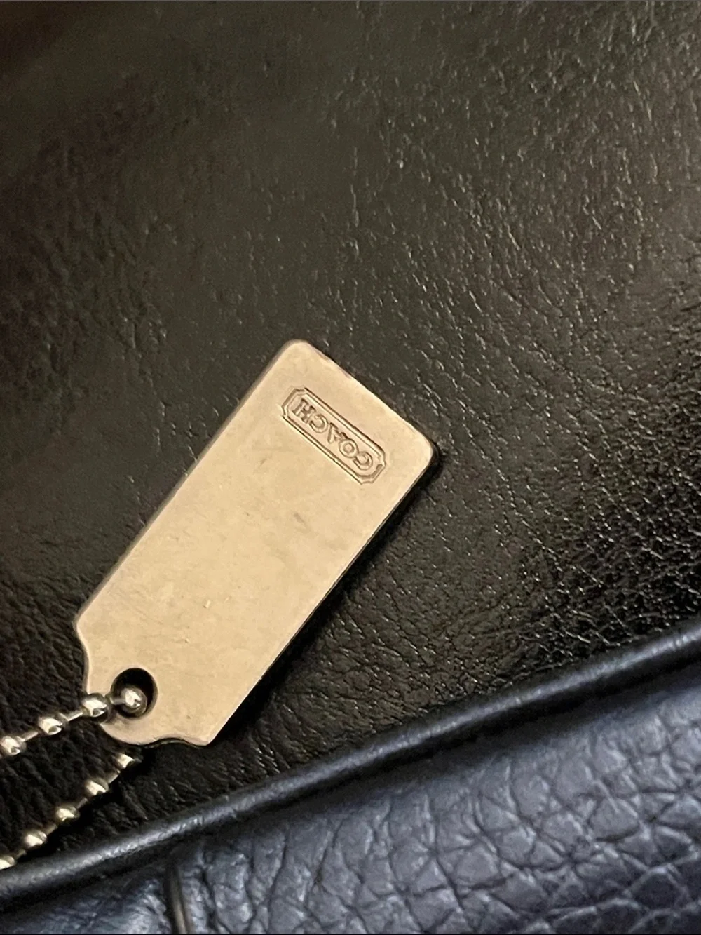 Metallic blue Coach crossbody purse